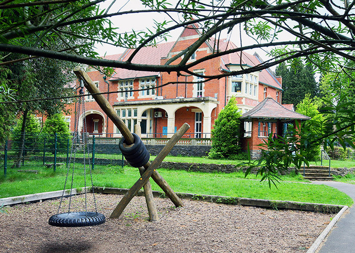 Orbis Group - Birchwood School outside of building with swings