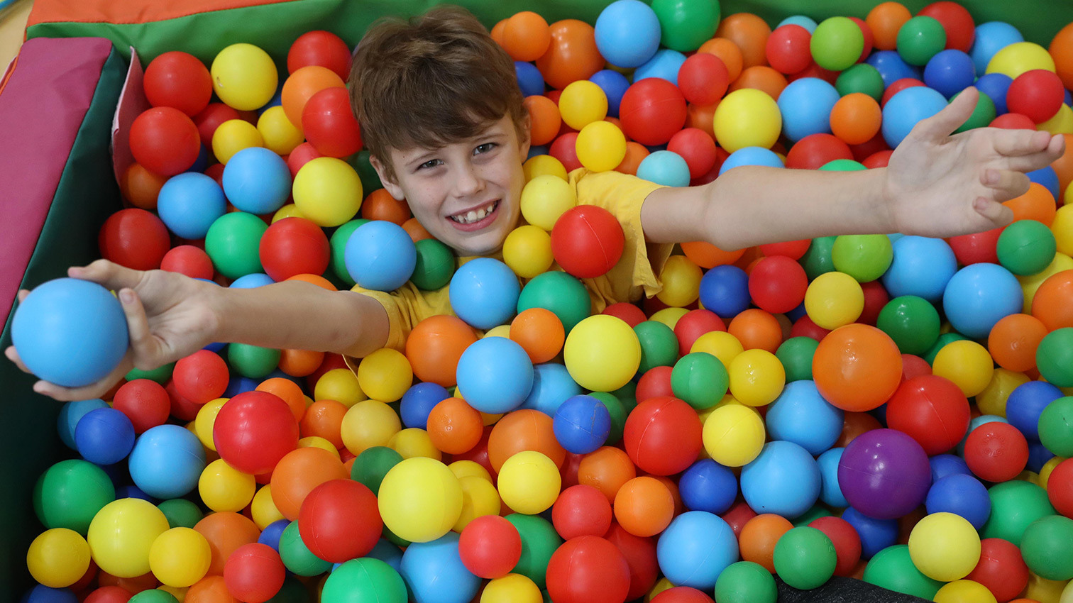 Orbis Group - Summergil house child playing in ball pit