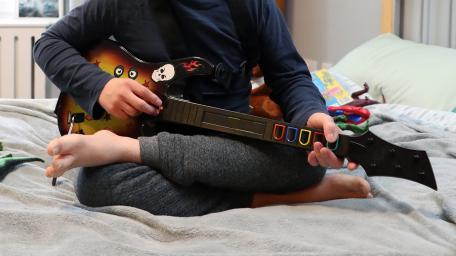 Orbis Group - Stockwell road playing guitar in bedroom